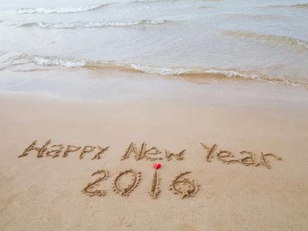 "Happy New Year"  drawn on sand — Stock Photo, Image