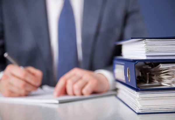 Businessman signing documents