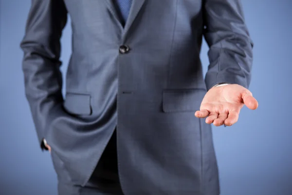 Businessman with open palm — Stock Photo, Image