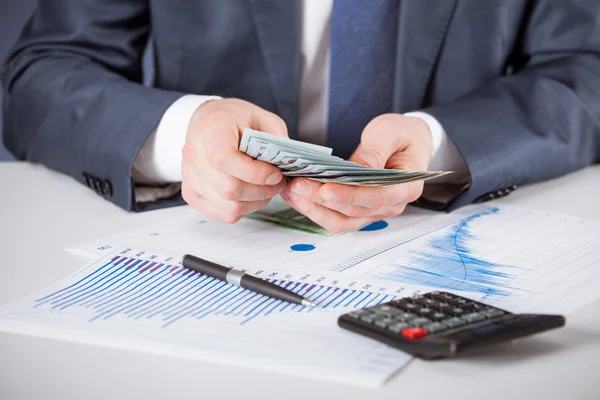 Businessman counting money — Stock Photo, Image