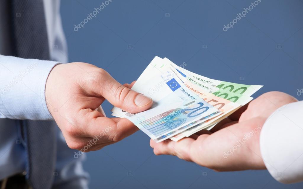 Businessman's  hands exchanging euro