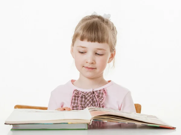 Little school girl learning to read — Stock Photo, Image