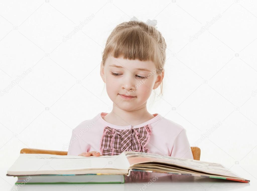 little school girl learning to read