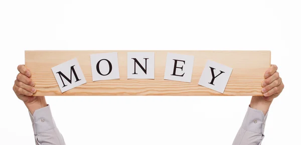 Businessman holding a wooden plate  "Money" — Stock Photo, Image