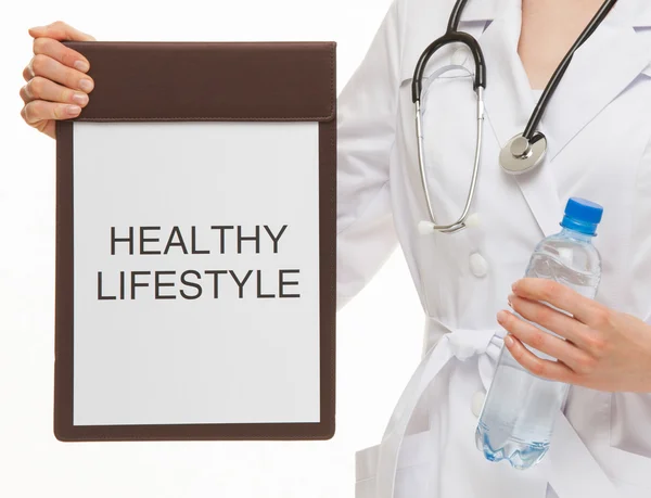 Doctor holding a clipboard — Stock Photo, Image