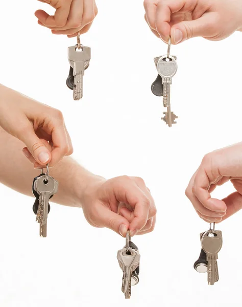 Mani umane che tengono mazzi di chiavi — Foto Stock