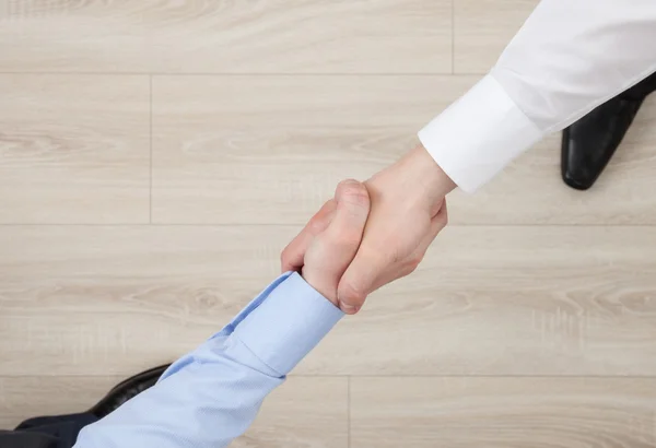 Businessmen shake hands — Stock Photo, Image