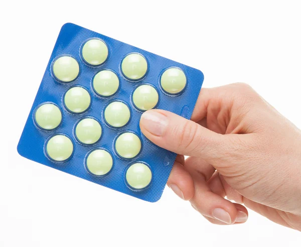 Female hand holding pills — Stock Photo, Image