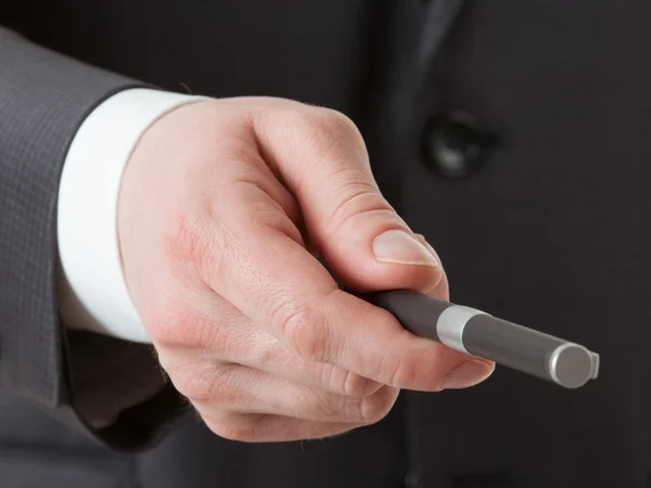 Geschäftsmann hält einen Stift in der Hand — Stockfoto