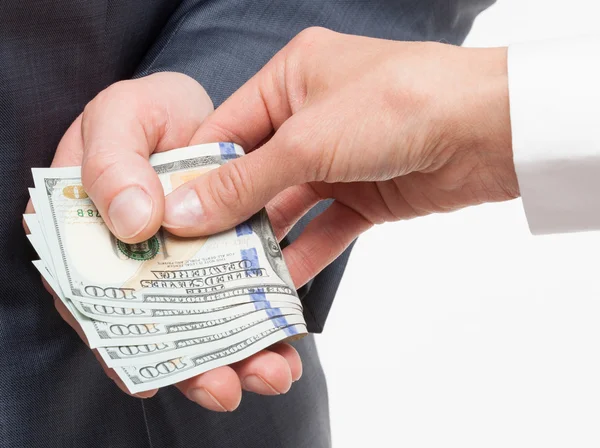 Businessman giving a bribe — Stock Photo, Image