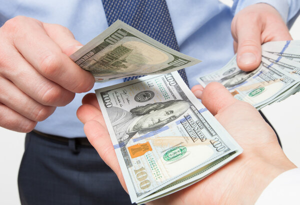 Human hands exchanging money