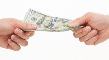 Businesspeople's hands holding dollars