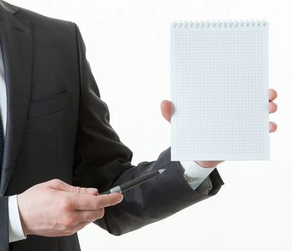 Empresário segurando um caderno vazio — Fotografia de Stock