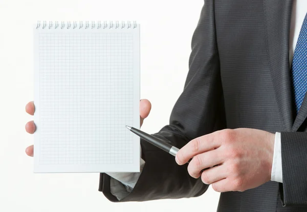 Unrecognizable businessman holding an empty notebook — Stock Photo, Image
