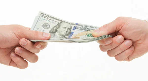 Mãos de empresários segurando dólares — Fotografia de Stock