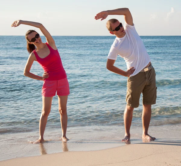 Woman and man doing exercises — Stock Photo, Image