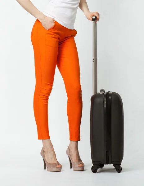 Playful young woman in orange pants — Stock Photo, Image