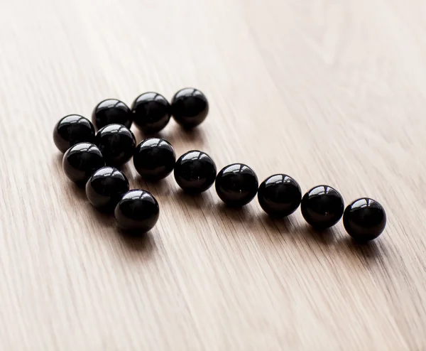 Arrow maked from black balls — Stock Photo, Image