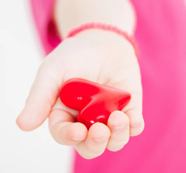 Unrecognizable little girl holding heart — Stock Photo, Image