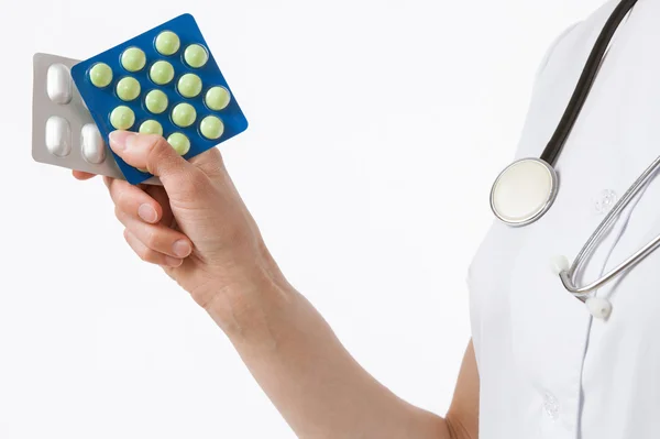 Doctor holding tablets — Stock Photo, Image