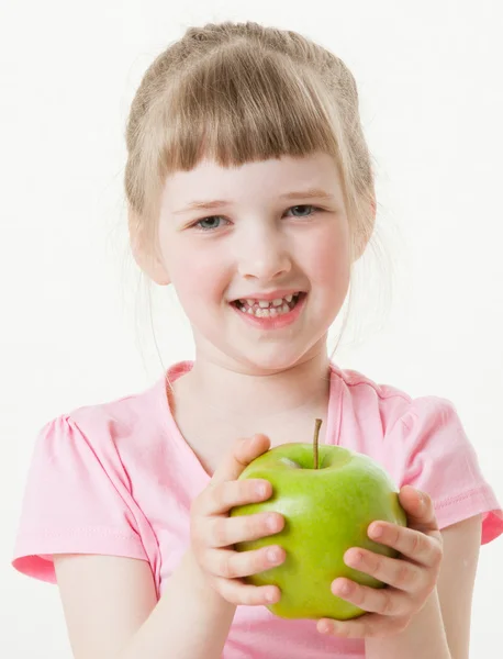 Little girl holding a green apple — Stock Photo, Image