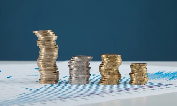 Four columns of coins on the table — Stock Photo, Image