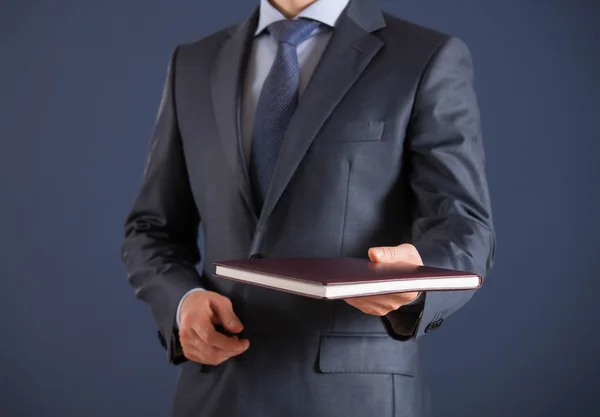 Man giving a book — Stock Photo, Image