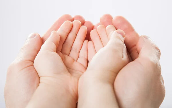 Child's palms in fathers palms Stock Photo
