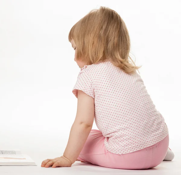 Little child sitting on the floor — Stock Photo, Image