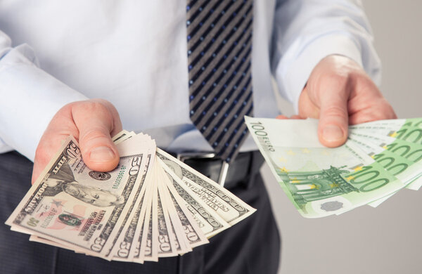  Businessman's hands giving banknotes to you