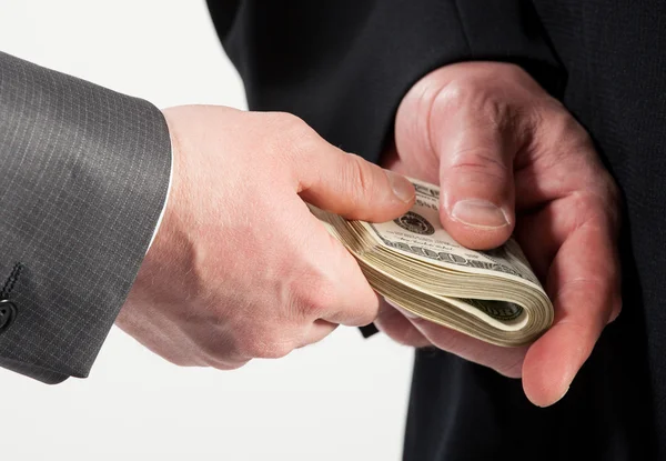 Businessman giving a bribe — Stock Photo, Image