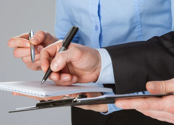 Business team taking notes — Stock Photo, Image