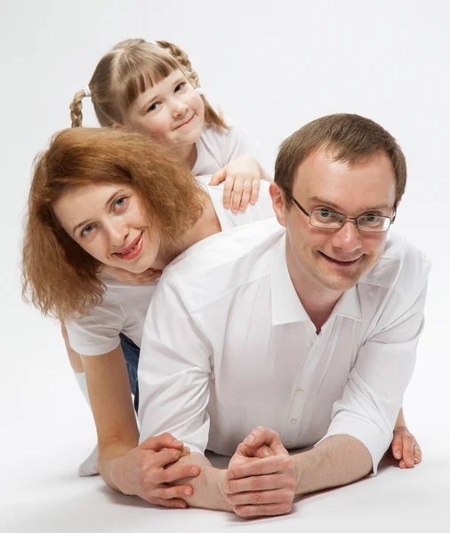 Happy family playing with daughter — Stock Photo, Image