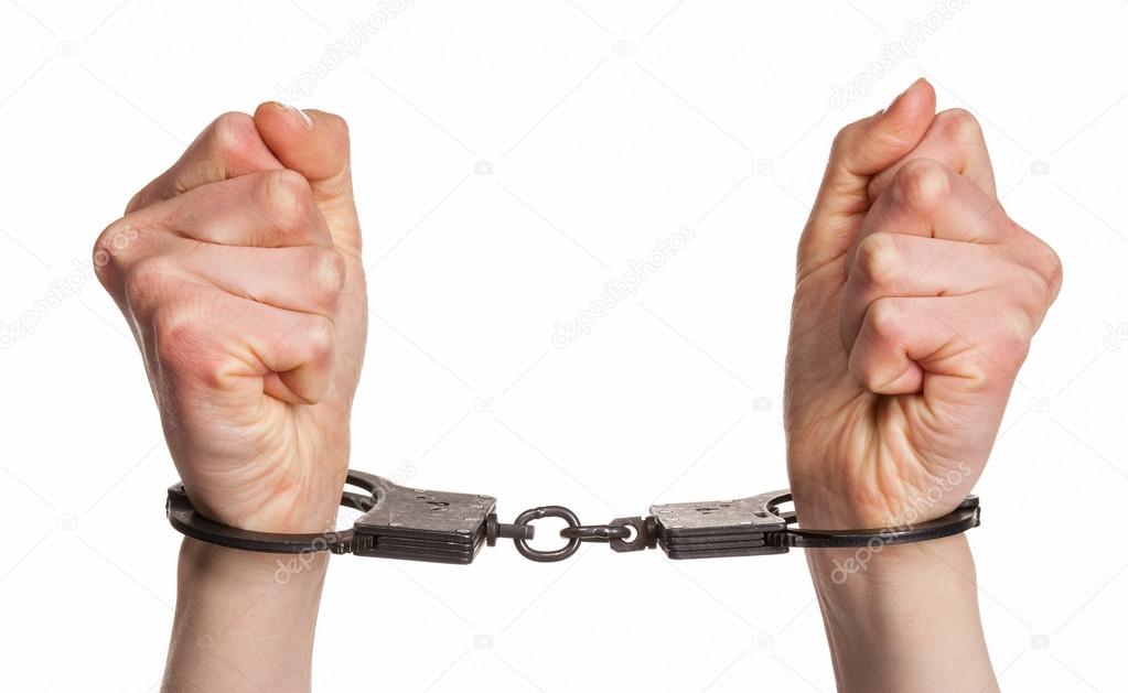 Hands in handcuffs close up