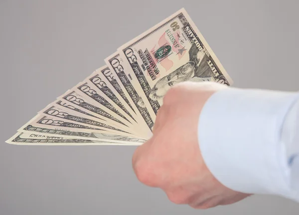 Hand met geld — Stockfoto