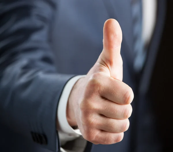 Businessman gesturing thumb up — Stock Photo, Image