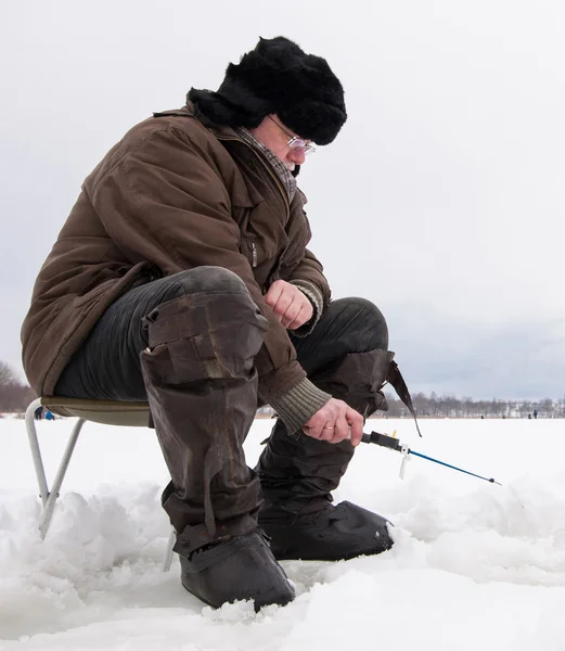 Fisherman at ice fishing — Stock Photo, Image