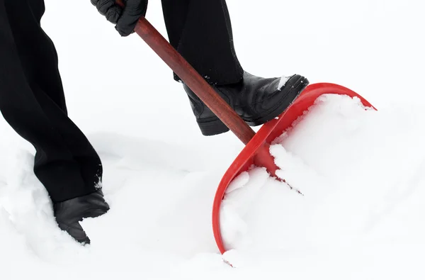 Man with shovel removing snow — Stock Photo, Image