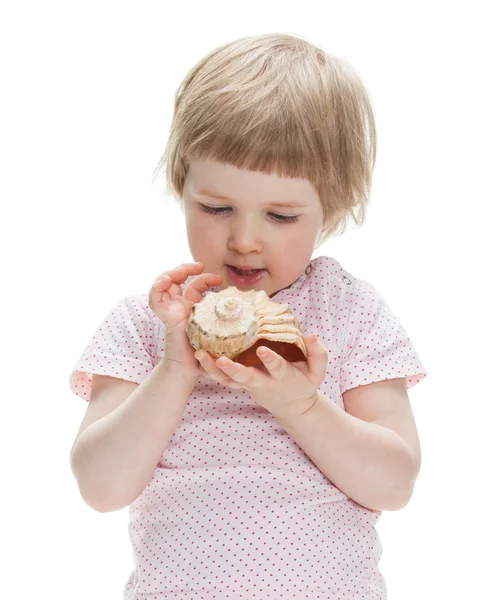 Girl playing with seashell — Stock Photo, Image