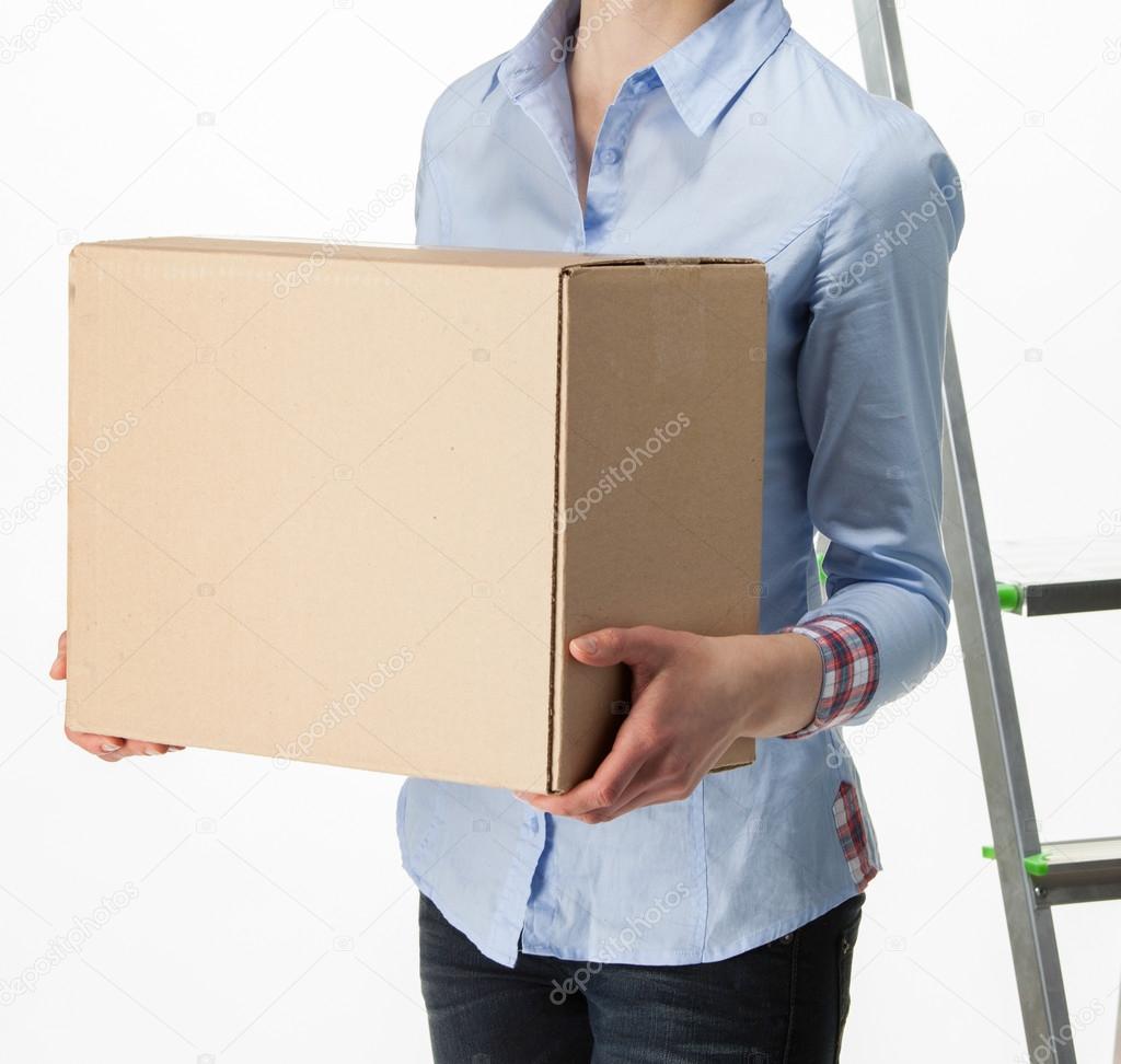 woman carrying big box