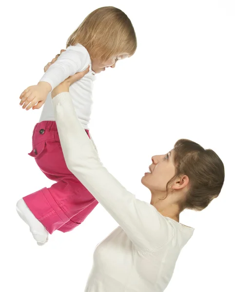 Smiling young mother raising daughter — Stock Photo, Image