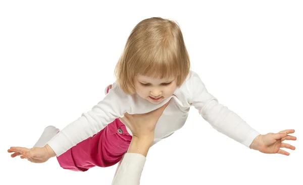 Manos sosteniendo a la niña sonriente — Foto de Stock