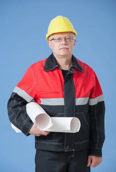 Mature builder holding projects — Stock Photo, Image
