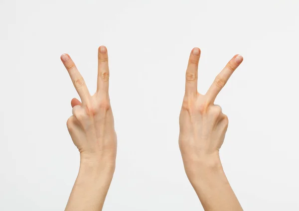 Hands showing victory signs — Stock Photo, Image