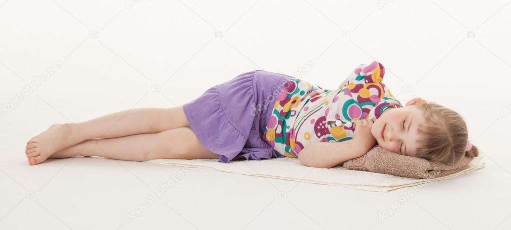 little girl resting on the floor