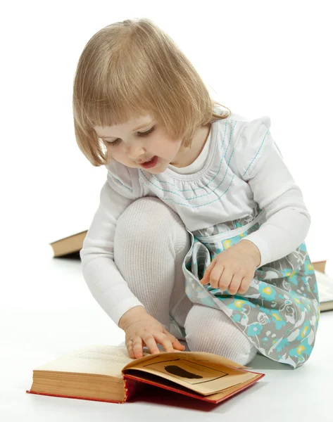 Kleines Mädchen mit Büchern — Stockfoto