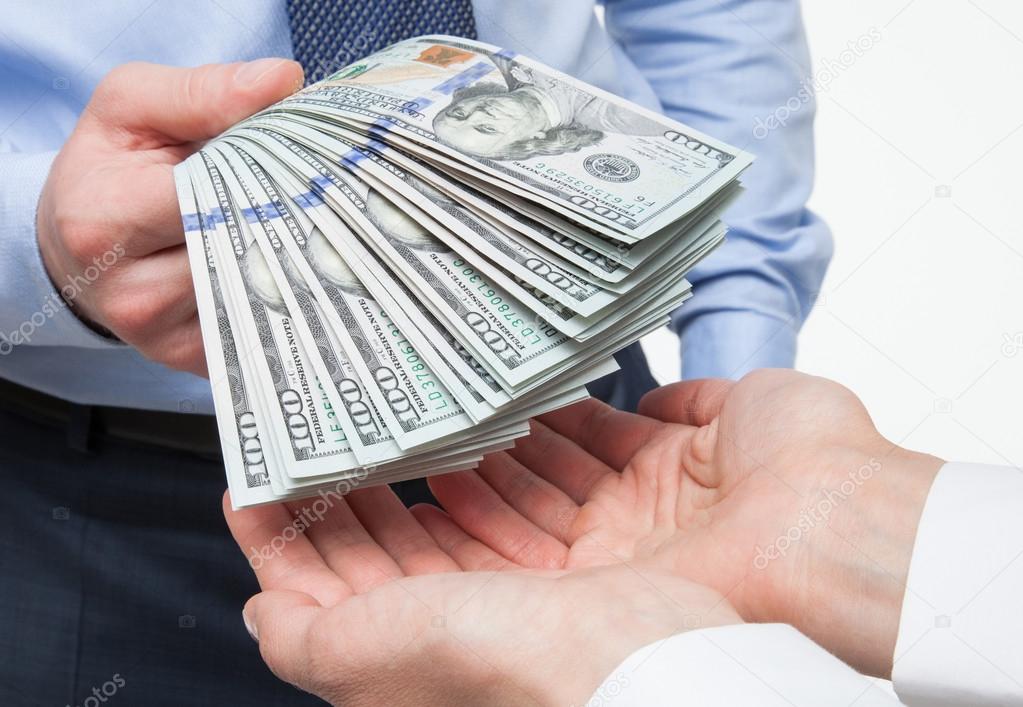 Hands exchanging money Stock Photo by ©zestmarina 95150182