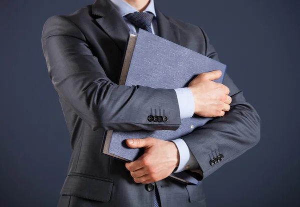 Businessman holding folder — Stock Photo, Image
