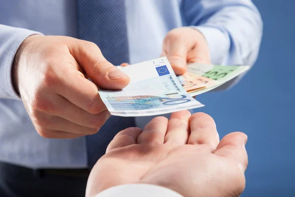 Hands exchanging money — Stock Photo, Image