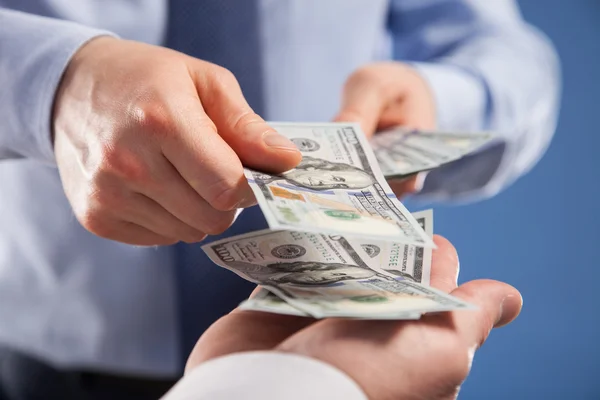 Hands exchanging money — Stock Photo, Image